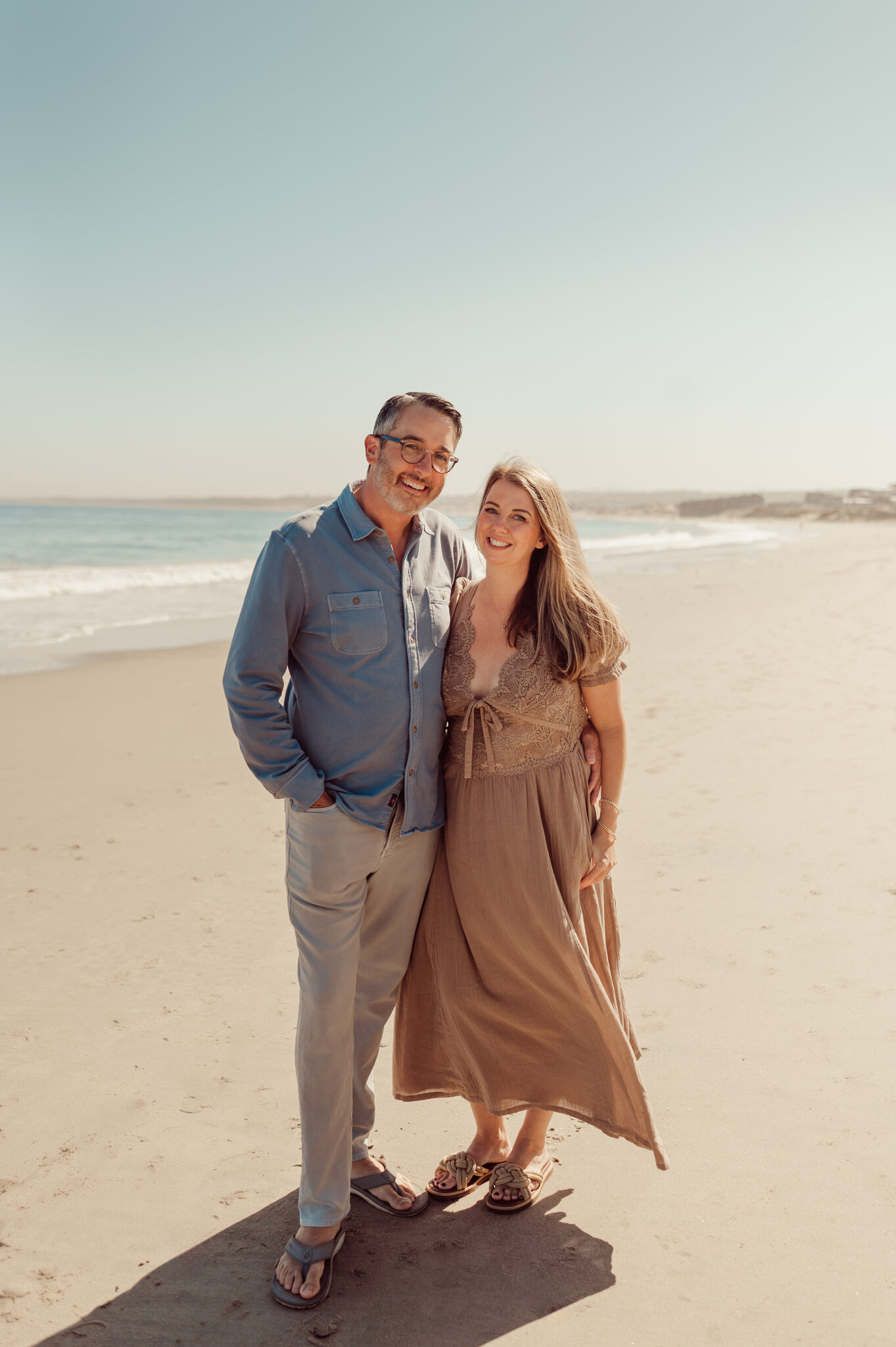 Husband and wife sharing a quiet moment together on the beach