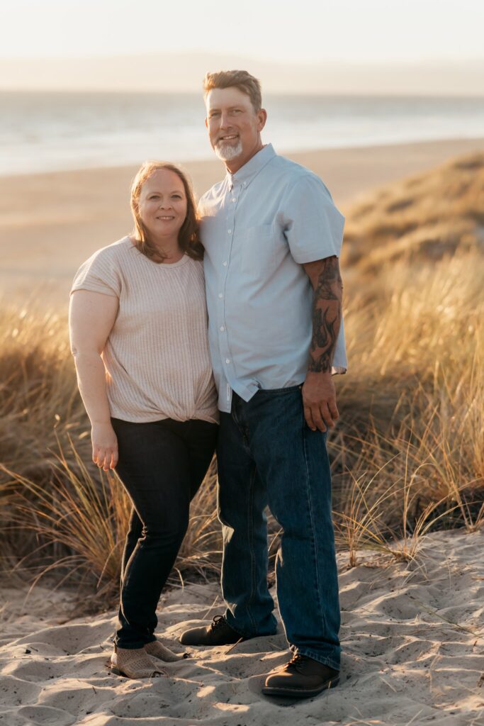 Mom and dad standing together on the dune at sunset, Pajaro Dunes