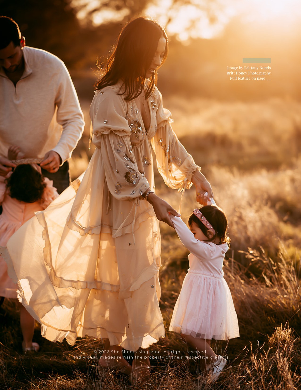 Mother and young daughter holding hands in golden evening light, the back cover image of She Shoots Magazine Volume 42, photographed by Brittany Norris of Britt Honey Photography